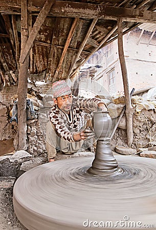Bhaktapur indigenous potter makes earthenware with turning wheel