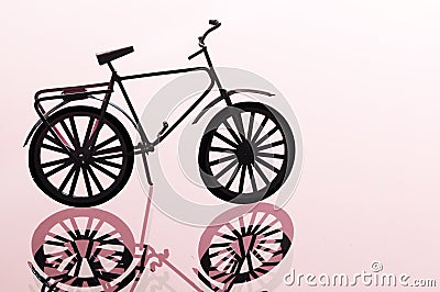 Bicycle against light red background