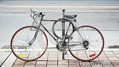 A bicycle locked up on the street