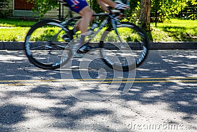 Bicycle Racing Down Residential Street
