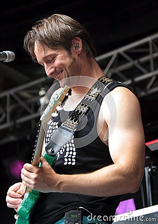 Biff Anderson plays guitar on stage