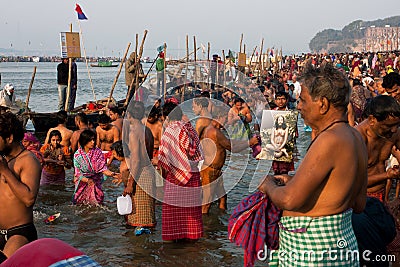 Big crowd of people in the river Ganges