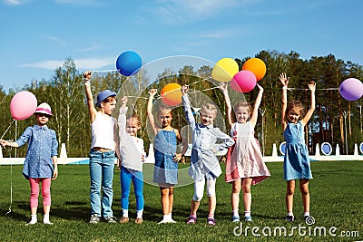 Big group of happy children with balloons
