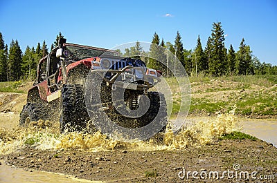 Big Jeep splashing mud in the mountains #2