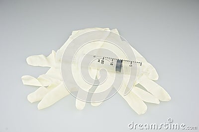 Big plastic syringe place on latex gloves