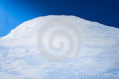 Big snow hummock of pure white snow made ​​wind