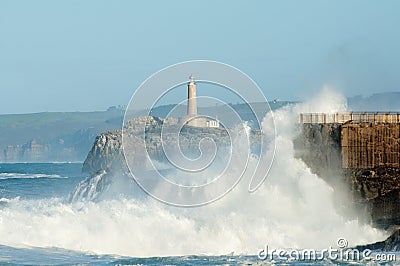 Big waves against the rocks. Santander lighthouse, Cantabria, Spain