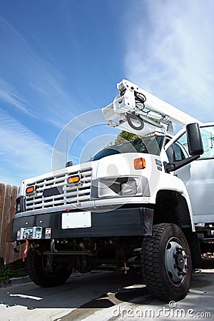 Big white diesel truck with boom