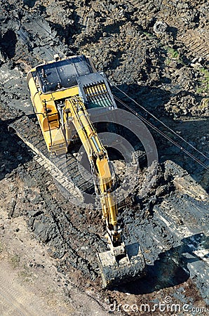 Excavator on the river bed. Top view.
