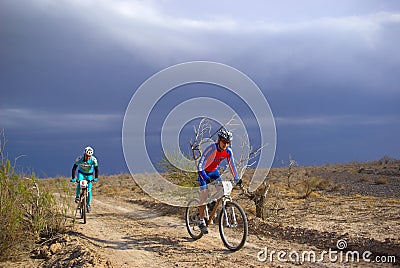 Bike race in storm desert