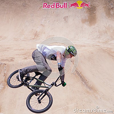 Biker Jumps in Front of Red Bull Logo