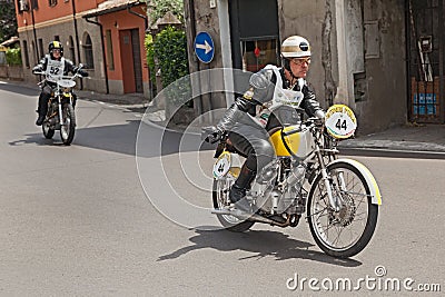 Biker riding an old italian bike Rumi SS TT