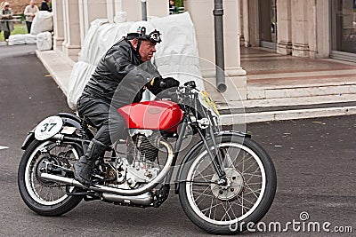 Biker riding a vintage motorcycle Gileta