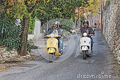 Bikers riding italian scooters