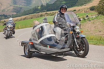 Bikers on a vintage Moto Guzzi California V850 with sidecar
