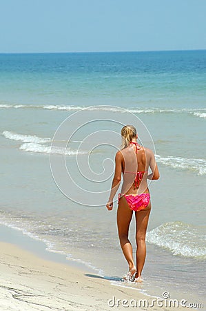 Bikini woman in surf