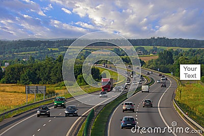 Billboards on the highway with cars