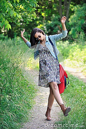 Biracial young woman kicking up her heels