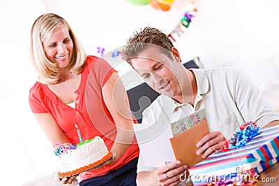 Birthday: Man Reads Card Before Getting Cake