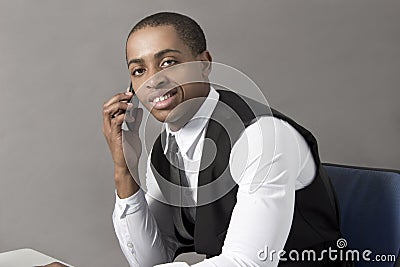 Black Business Man in office behind desk