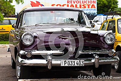 A black classic car on the street in havana cuba