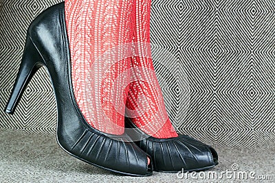 Black leather shoes with red tights