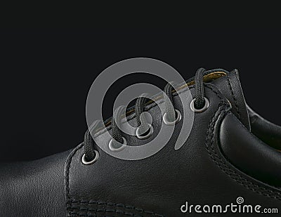 Black men s shoe on black background