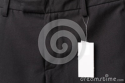 Black pants close up with white label
