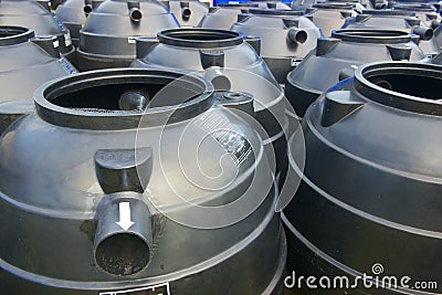 Black plastic water storage tanks