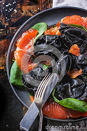 Black ravioli with salted salmon