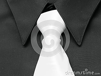 Black shirt. White tie