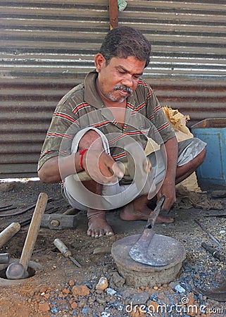 Black smith in a market szene in India