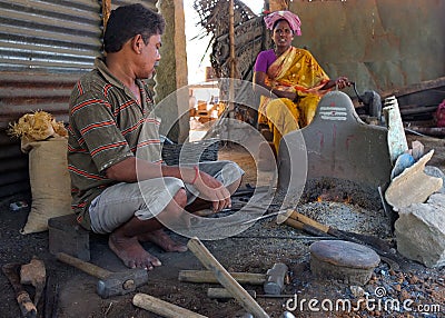 Black smith in a market szene in India
