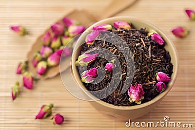 Black tea leaves with rose buds