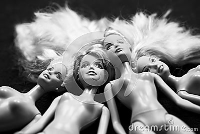 Black and white composition with Barbie dolls