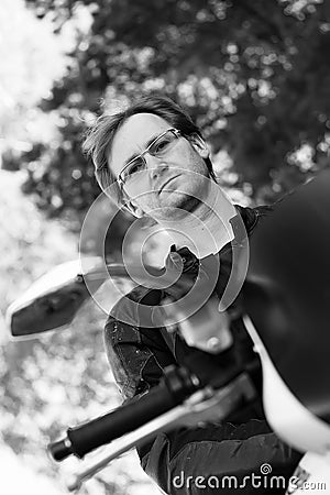 Black and white portrait of man on the bike