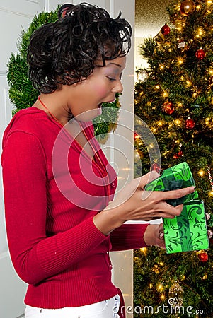 Black Woman Holding a Christmas Ornament