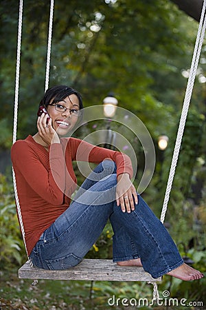 Black woman outside on cell phone