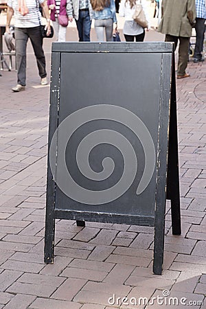 Blank blackboard advertising sign in pedestrian