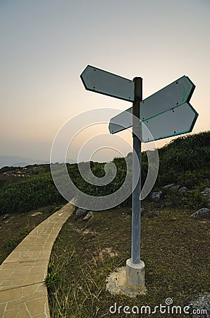 Blank Direction Sign at Sunset
