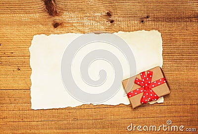 Blank and gift box on wooden background