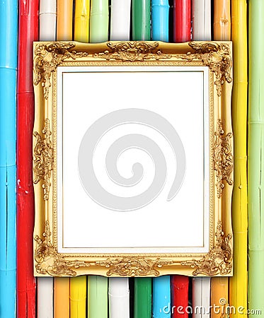 Blank golden frame on colorful bamboo wall