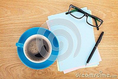 Blank lined paper with coffee, office supplies and glasses