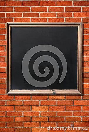 Blank menu blackboard on a brick wall.