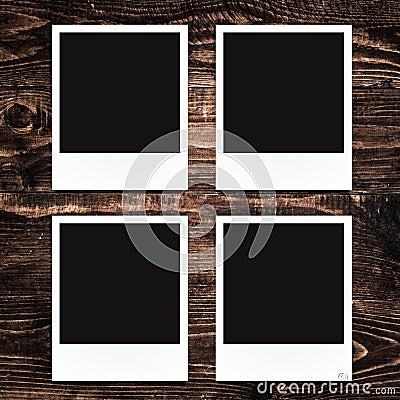 Blank photo frames on wood background