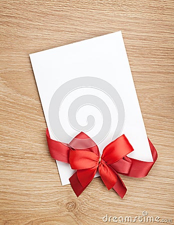Blank valentines greeting card and red ribbon