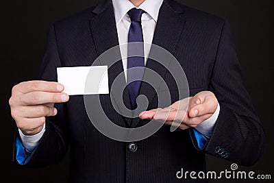 Blank visiting card in business man hand