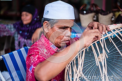 Blind Man Weaving Basket