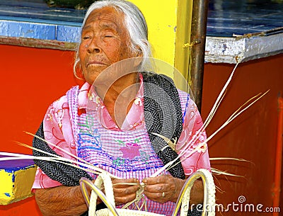 Blind senior female basket maker, Mexico