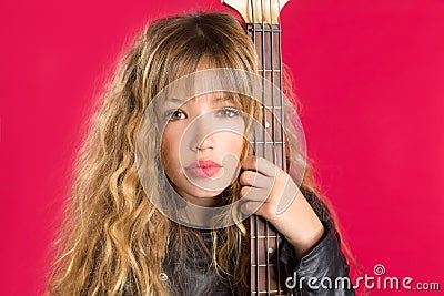 Blond Rock and roll girl with bass guitar on red